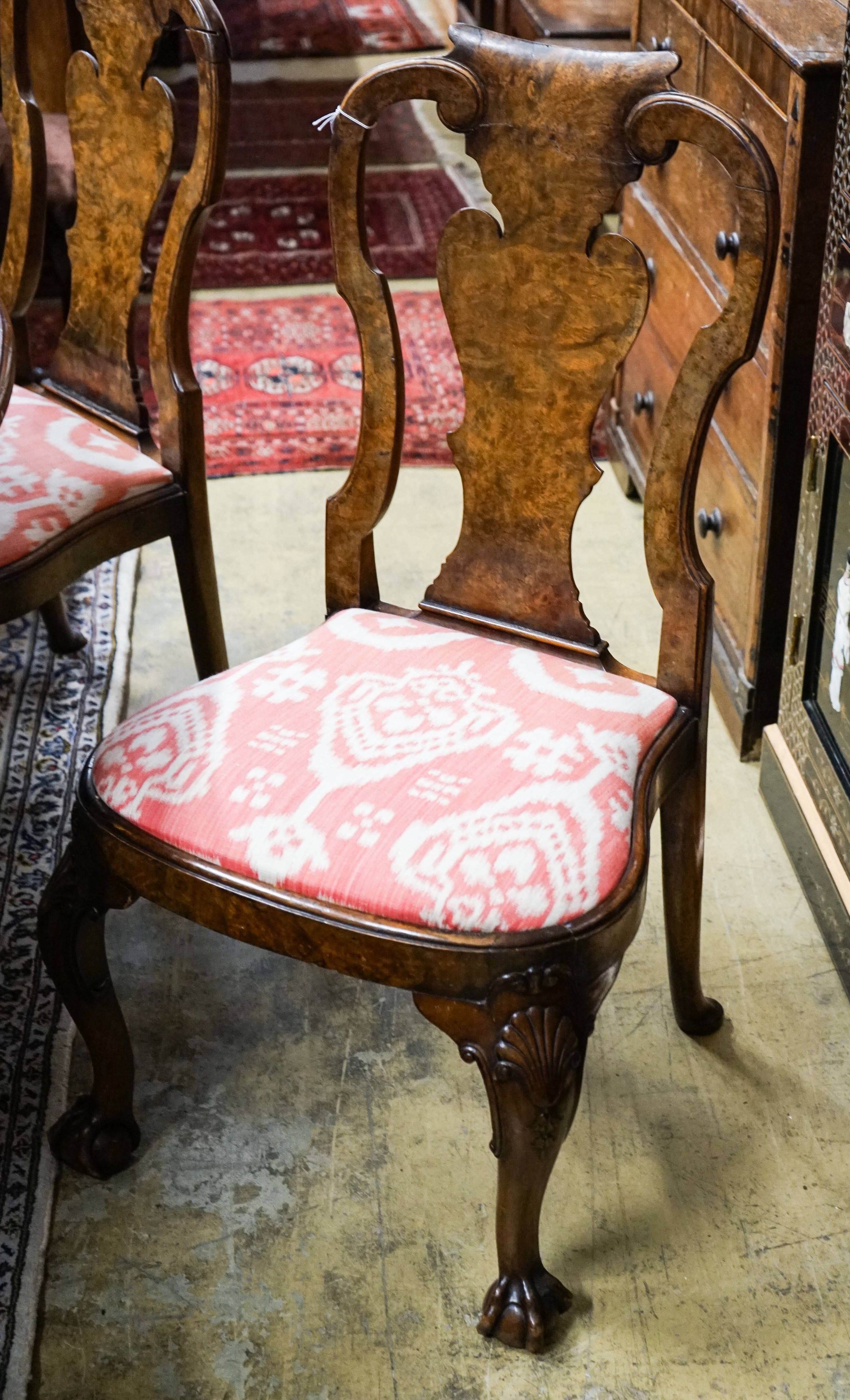 A set of four Queen Anne revival walnut dining chairs